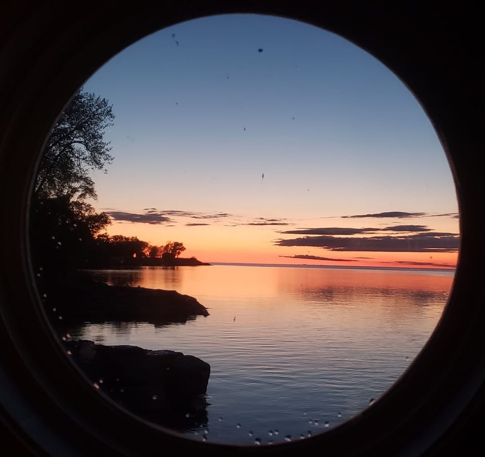 Sunset over the lake through our bathroom window.