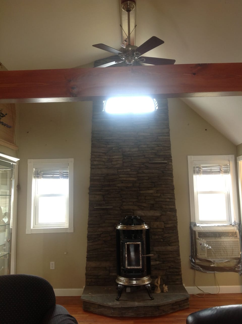 Exposed rock face, cathederal ceilings facing the back of the home.