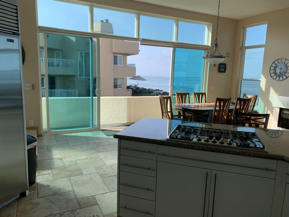 Kitchen and dining area opens to beach access