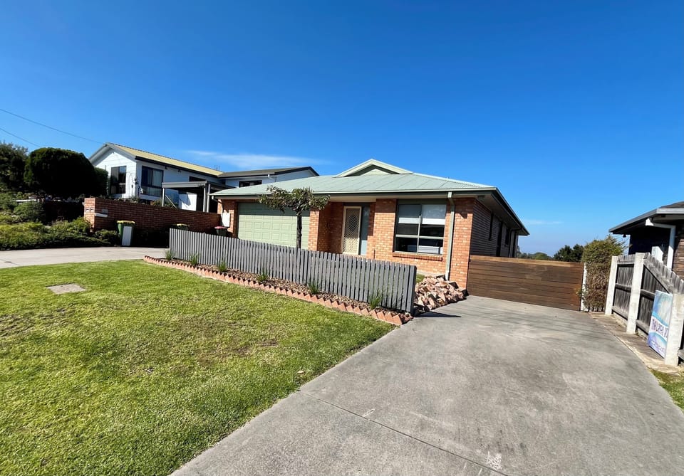Secure automatic garage,  long sleep driveway down the side of house.