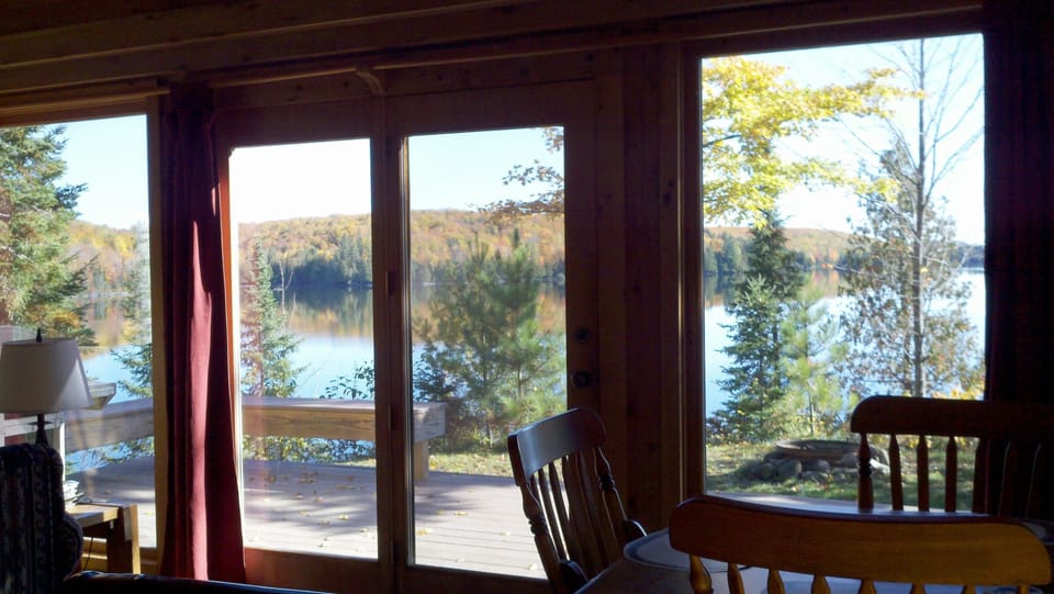 wall of windows facing Porter Lake