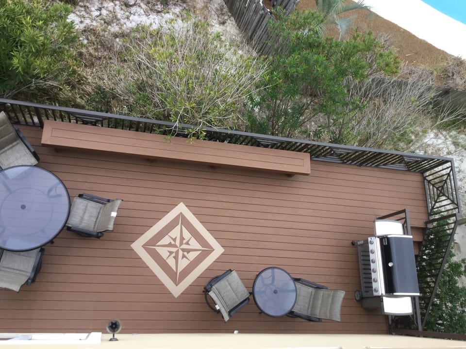 1st floor deck with plenty of seating and Weber 6 burner gas grill.