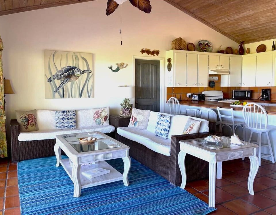 Spacious living room with 16 feet glass wall overlooking the ocean. Great view!