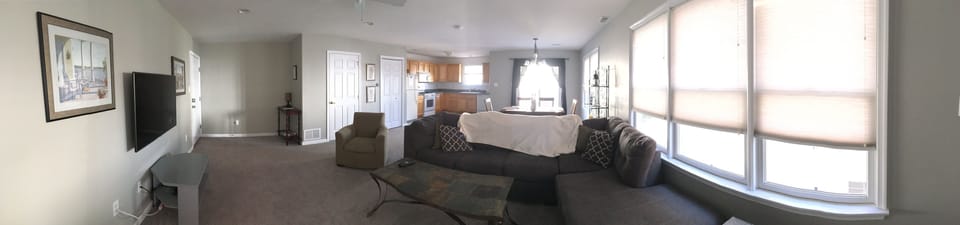 Downstairs panoramic picture of living room and kitchen.  