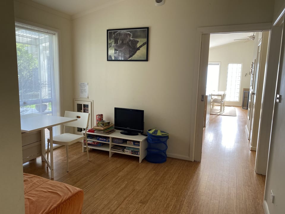 Kids' space looking down hall to living area