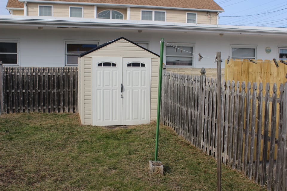 shed in the back yard for beach chairs and the cart