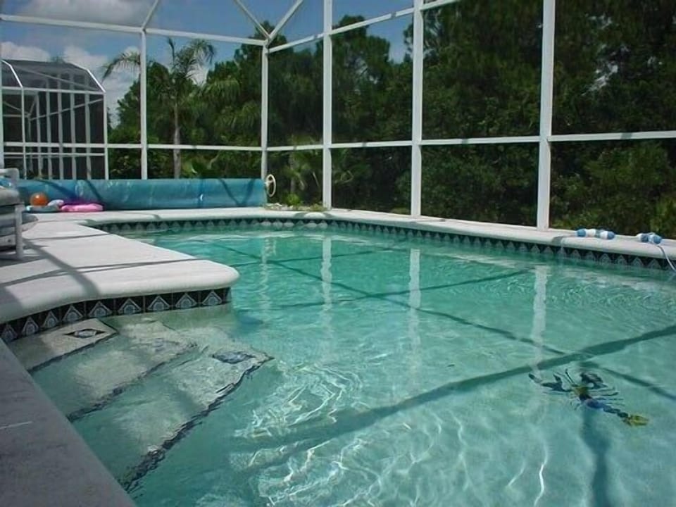 Oversized heated pool with fully screen enclosure