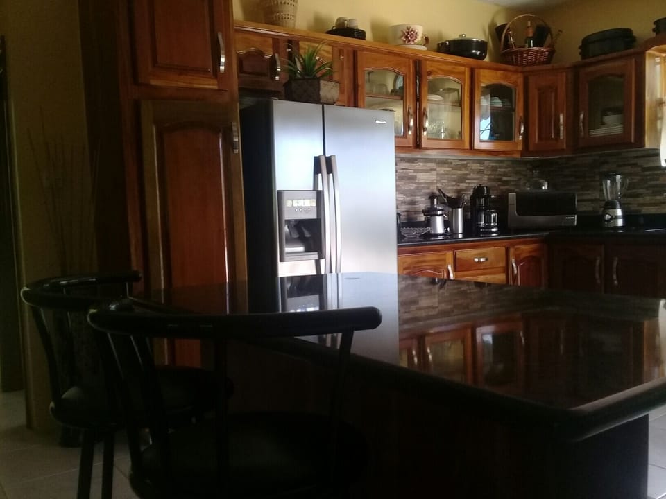 Spacious, modern, fully equipped kitchen- literally two steps away from the pool