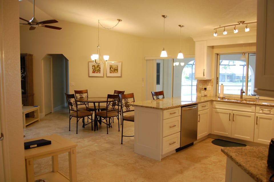 Kitchen with dishwasher & dinette.  2 kitchen counter seats.