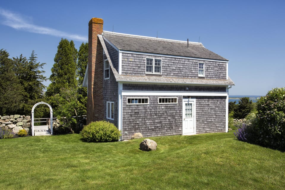 The hillcrest-set cottage is part of a landmark, up-island property.