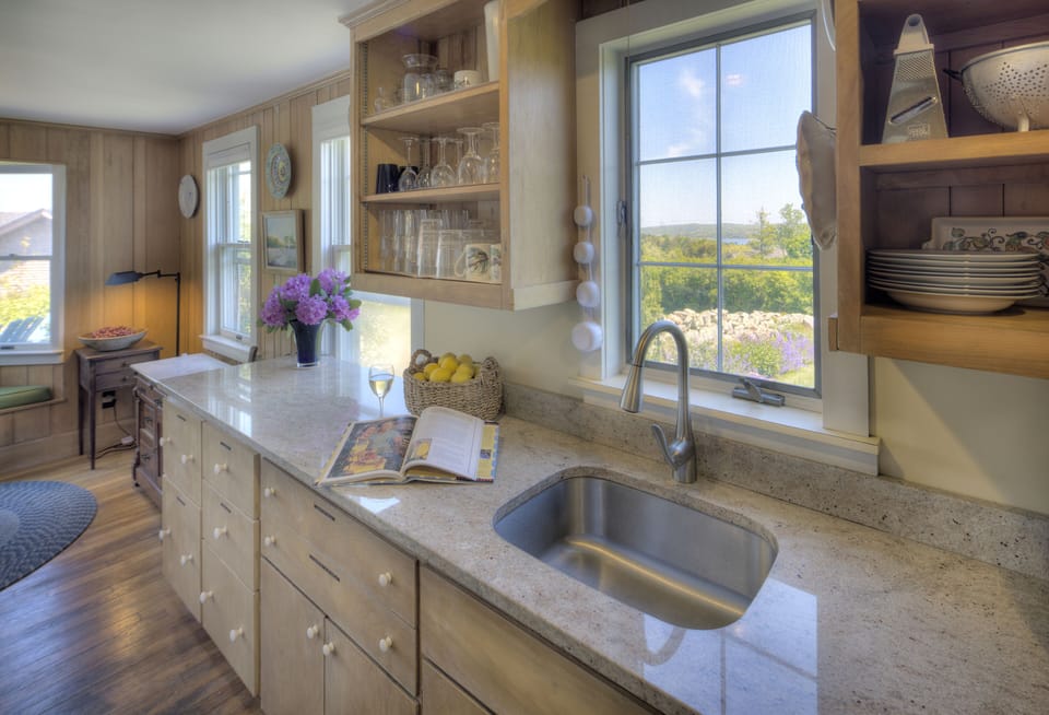 Whip up tasty meals in the sunny, ample kitchen, open to the dining area.