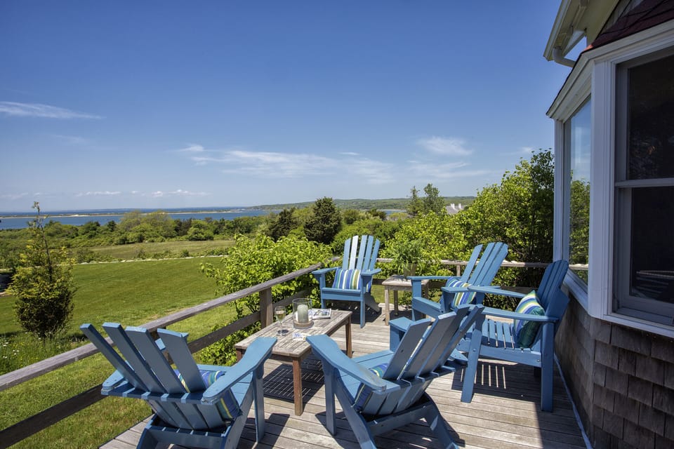 Enter via an arbor to a walled garden,  a gathering-area deck, and front entry.