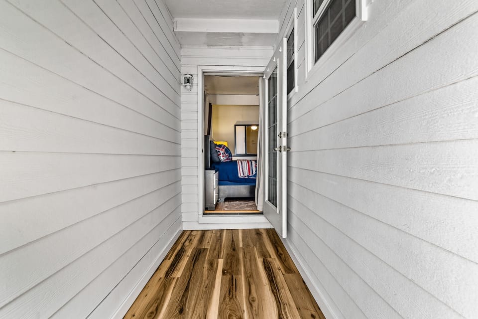 Hall off of main bedroom to back yard.