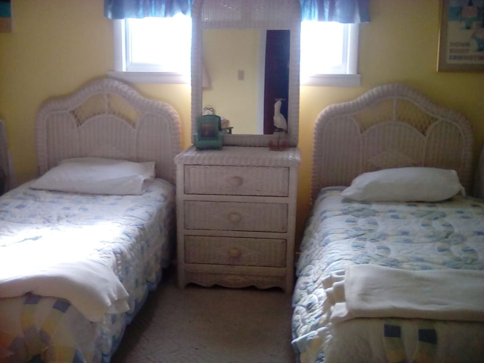 Two single beds that can be pushed together for a queen size.
