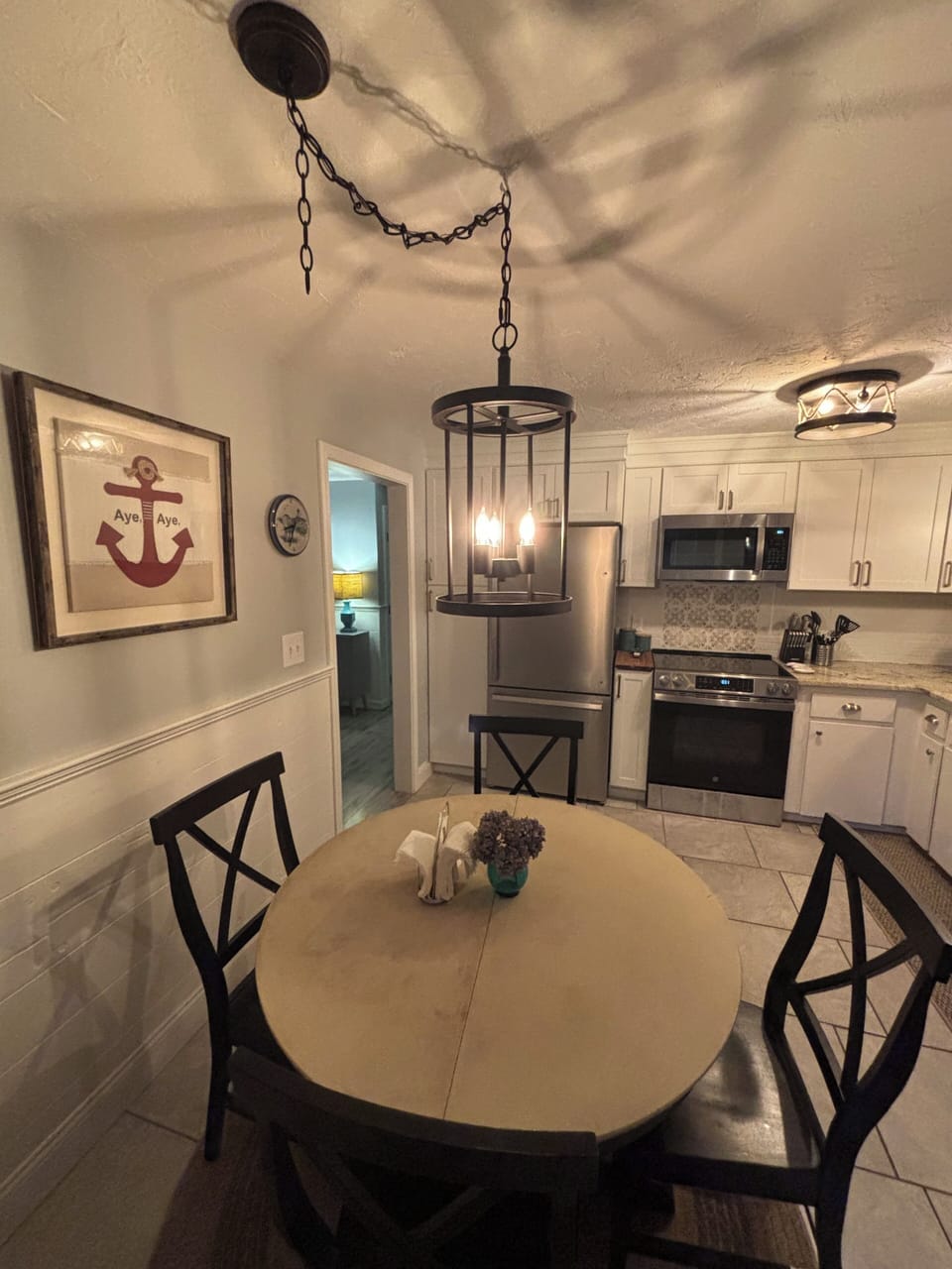 Renovated kitchen with new stainless refrigerator, slide in range, microwave, 