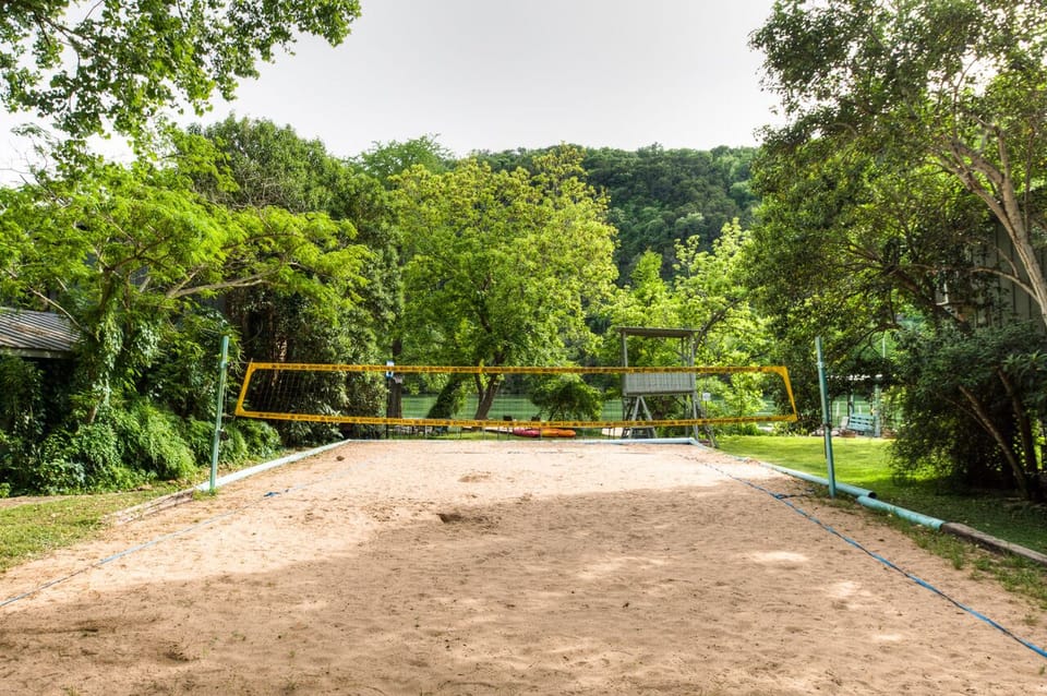 Guests use the court for volleyball, badminton, really big sand box!