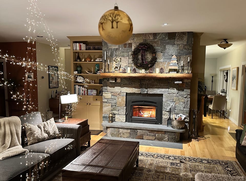Curl up on the sectional w/ stone wood burning firelplace and cross valley views