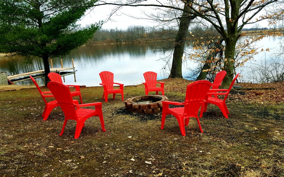 firepit area between the house and lake