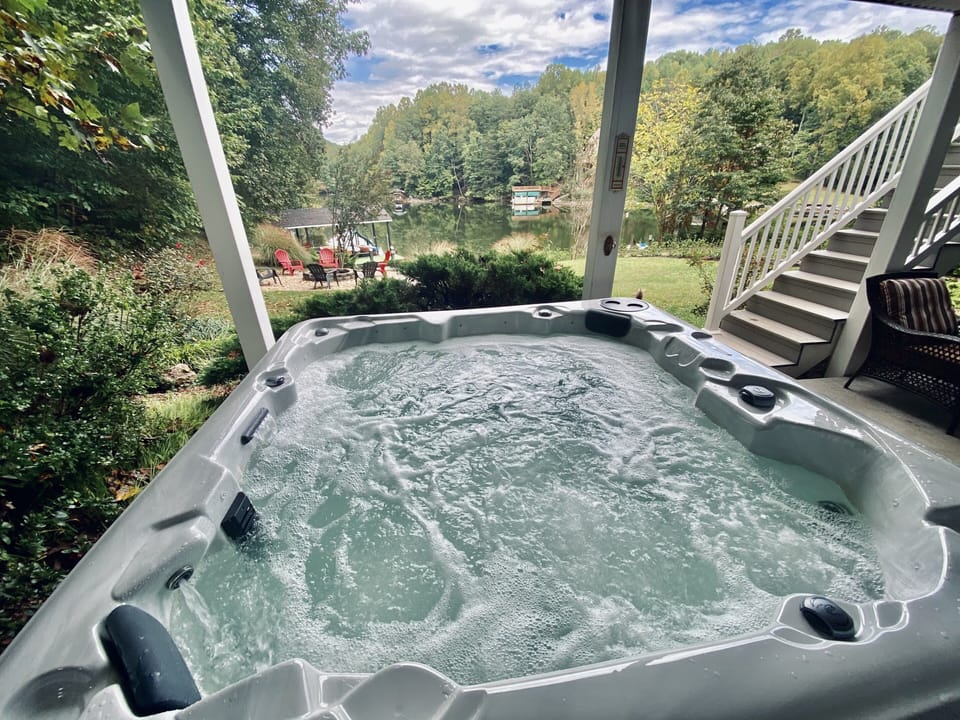 Relax in the hot tub while enjoying lake views