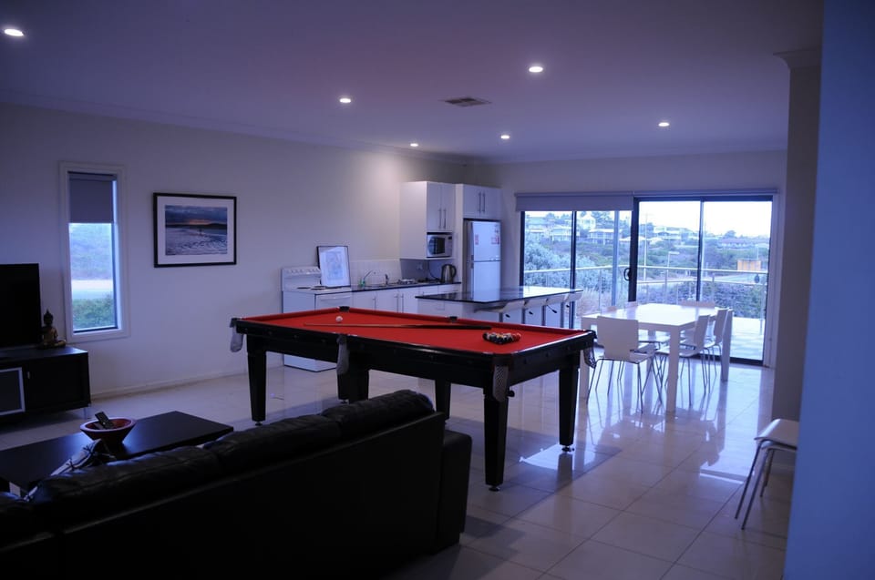 Downstairs living/billiard/kitchen and dining area