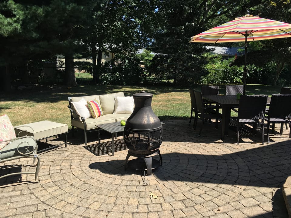 Backyard Patio, fire pit and table seating for 14.