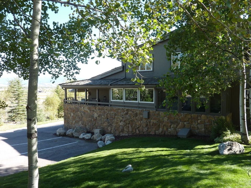 Exterior View, Beautiful Landscaping, Large Aspens and Evergreens