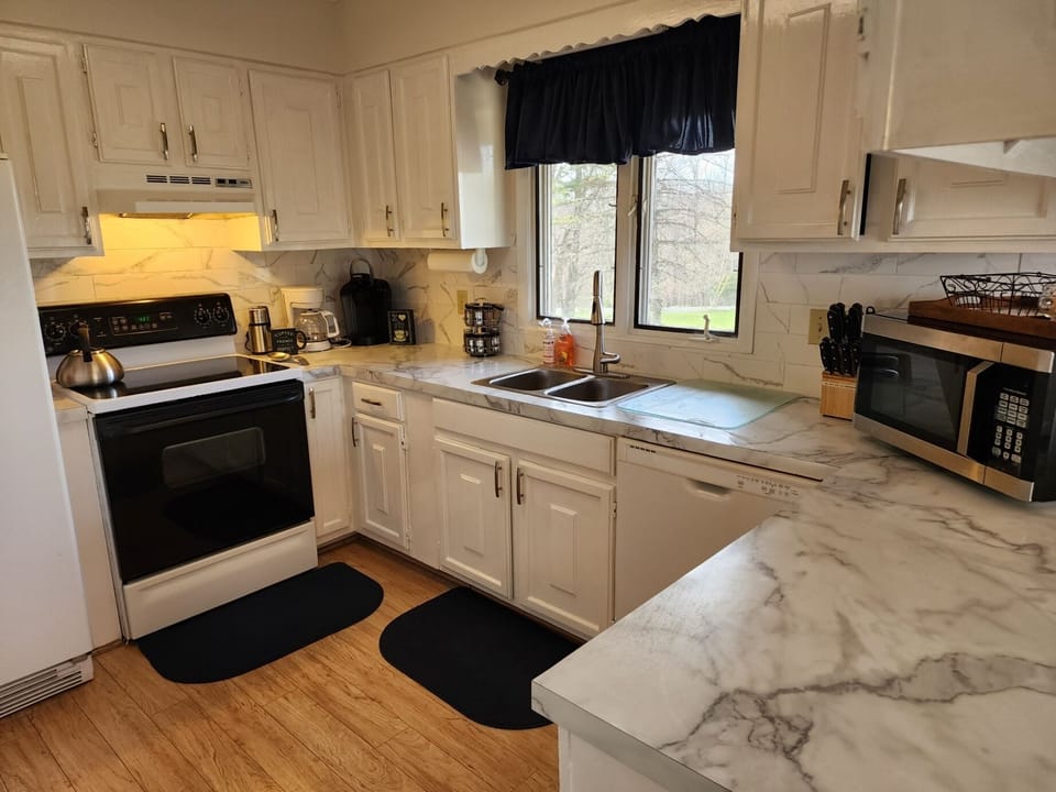 Glass top stove, dishwasher, icemaker with dispenser, garbage disposal