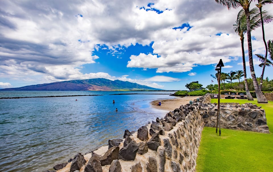 View to the right over Kō'ie'ie Fishpond with West Maui Mountains behind.