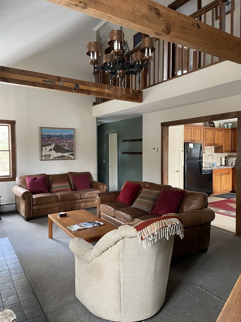 Living Room Showing Balcony Walkway on Second Floor and entry to Kitchen