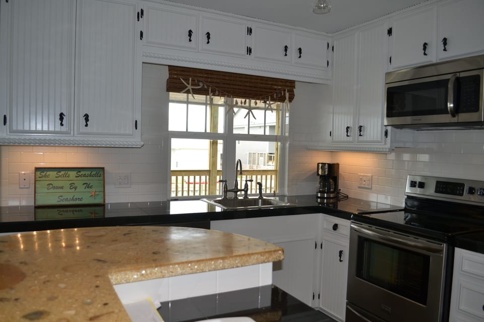 Easily pass items thru our window to the upper deck BBQ and outer dining area.