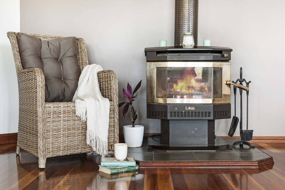 Wood heater in Family Room. Wood is cut and supplied for indoor use in winter.