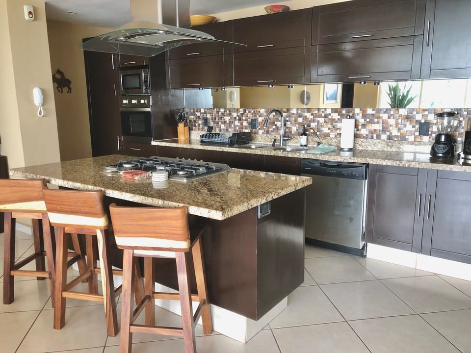 Kitchen island with bar stools