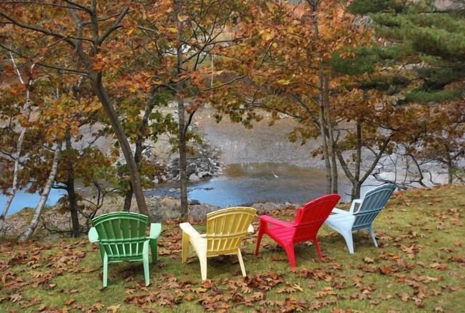 Front yard view with gas grill and seating for 10. A beautiful spot to be!