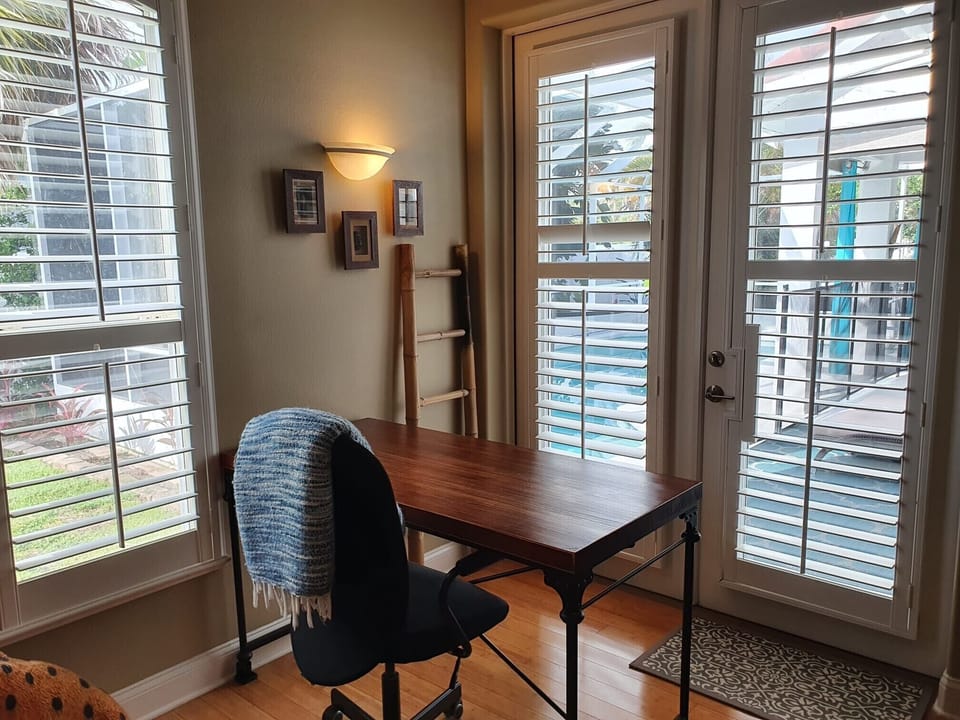 Work from home with pool views and direct access to the lanai.  