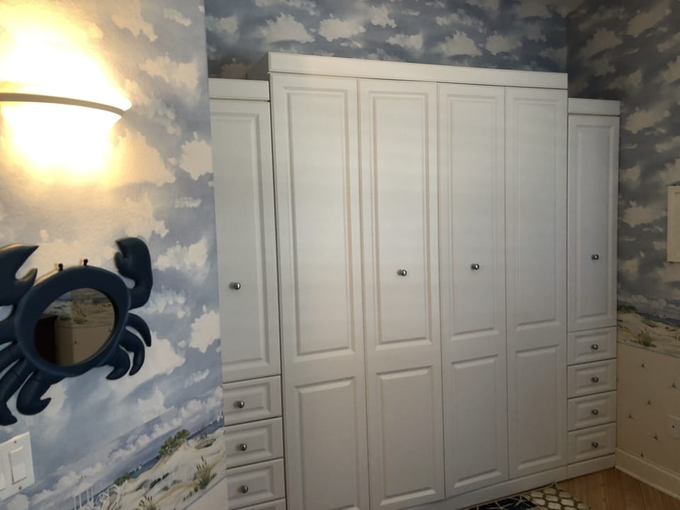 A queen-sized Murphy bed can be lowered to accommodate two additional people.