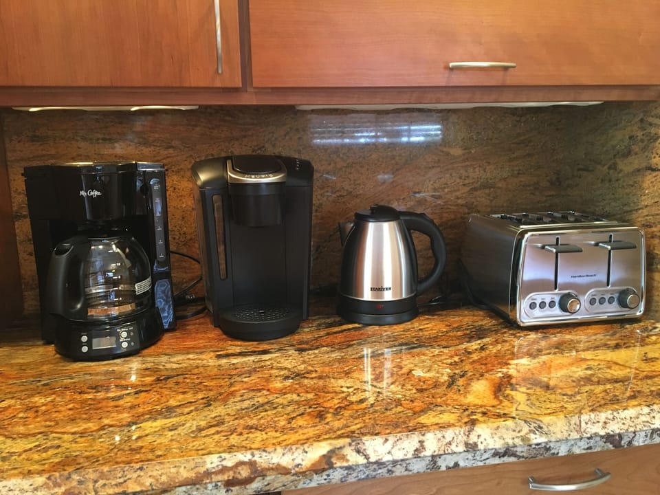 Keurig coffee machine & regular coffee machine &  an electric kettle.