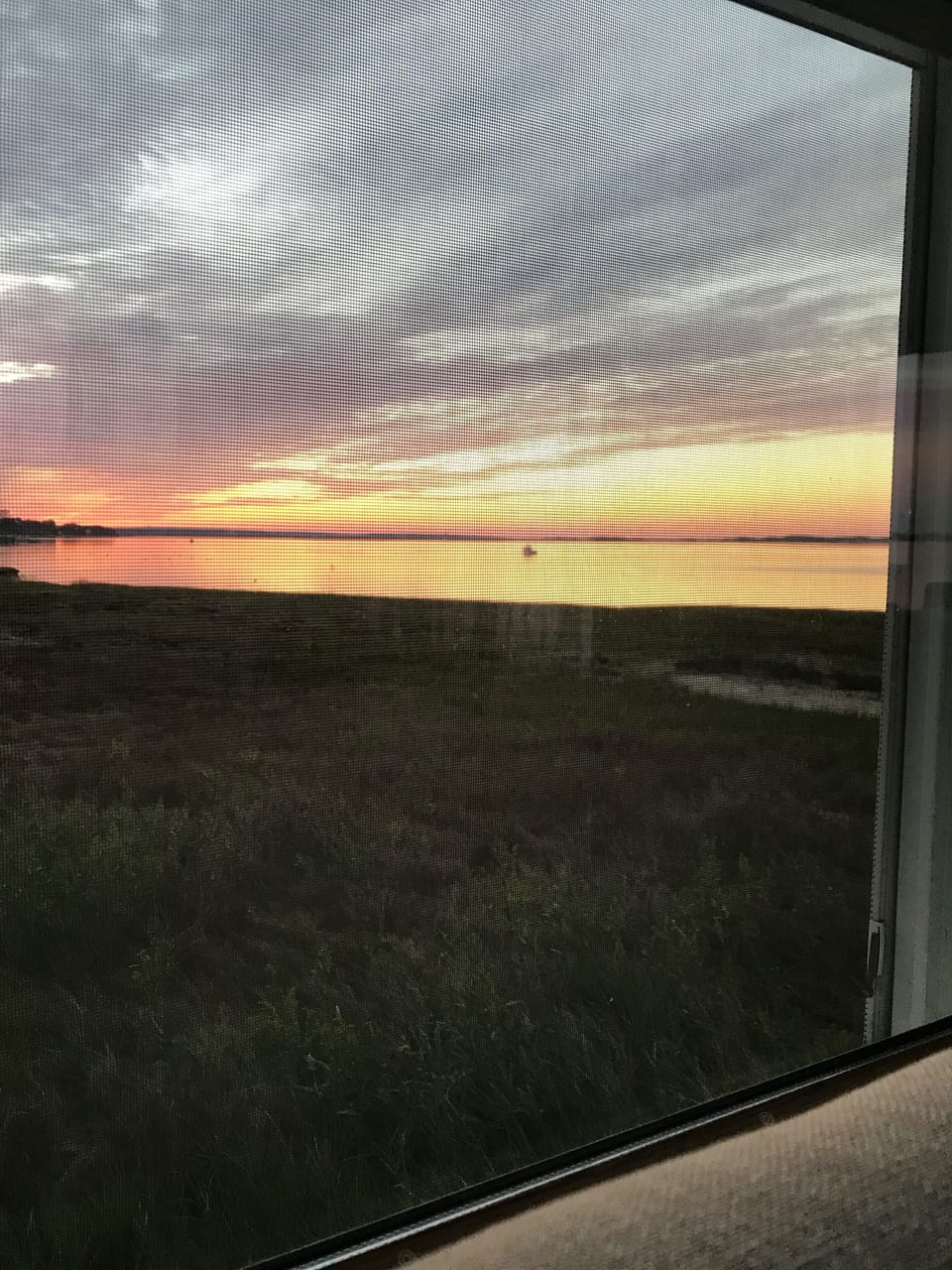 A view of a sunset while sitting on couch in living room. No need to move!