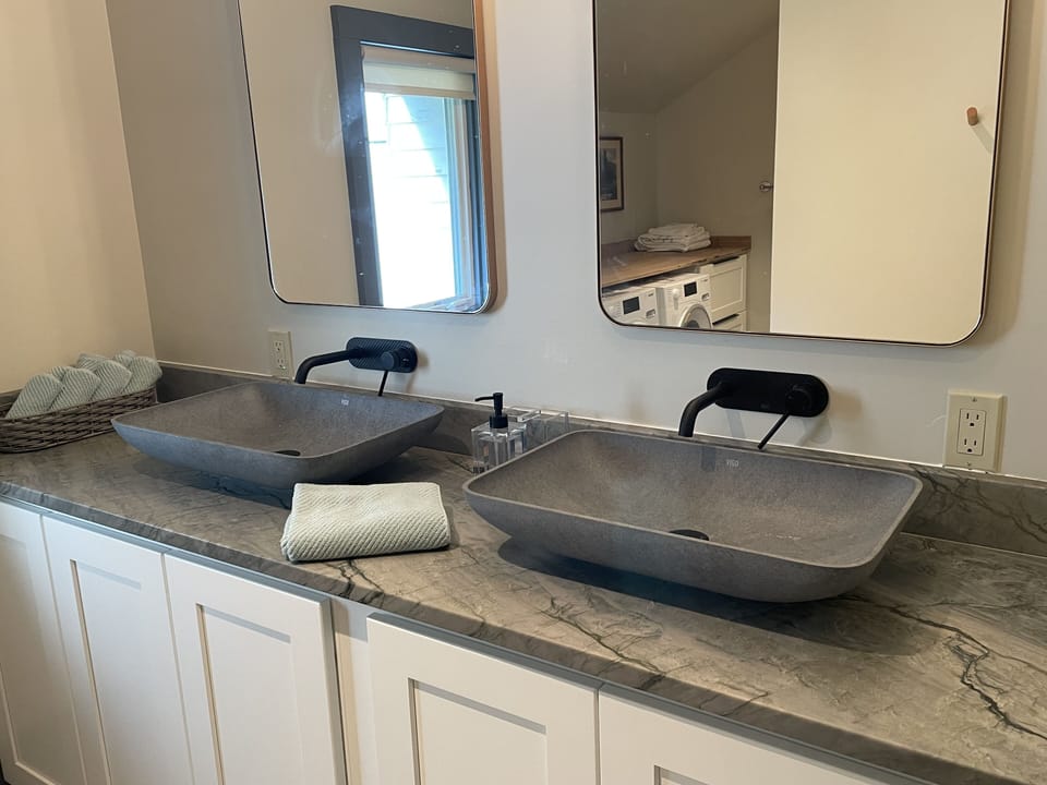 All new main bathroom with roomy double sinks.