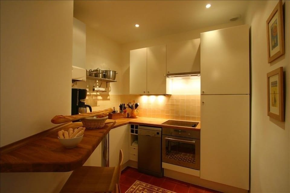 well-equipped kitchen with provencal tiles