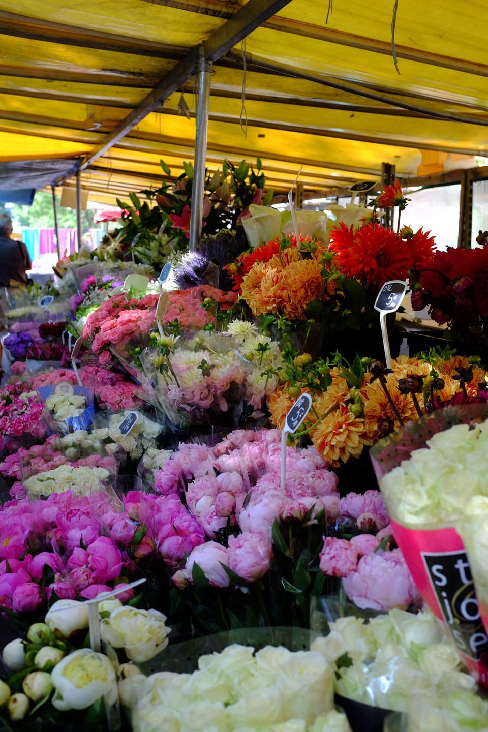 a flower stand at the nearby Bastille market