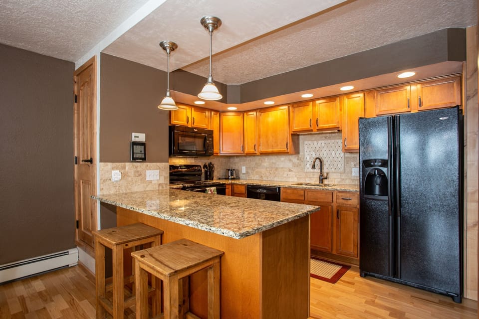 Kitchen with breakfast bar.