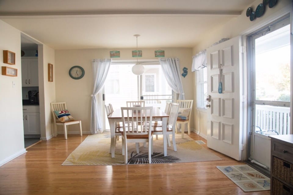 Dining room with seating for 8, slider to wrap around porch. 