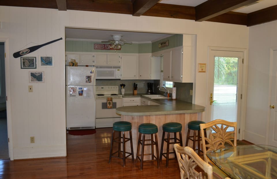 Fully appointed kitchen with counter seating.  Dishwasher, oven, microwave, etc