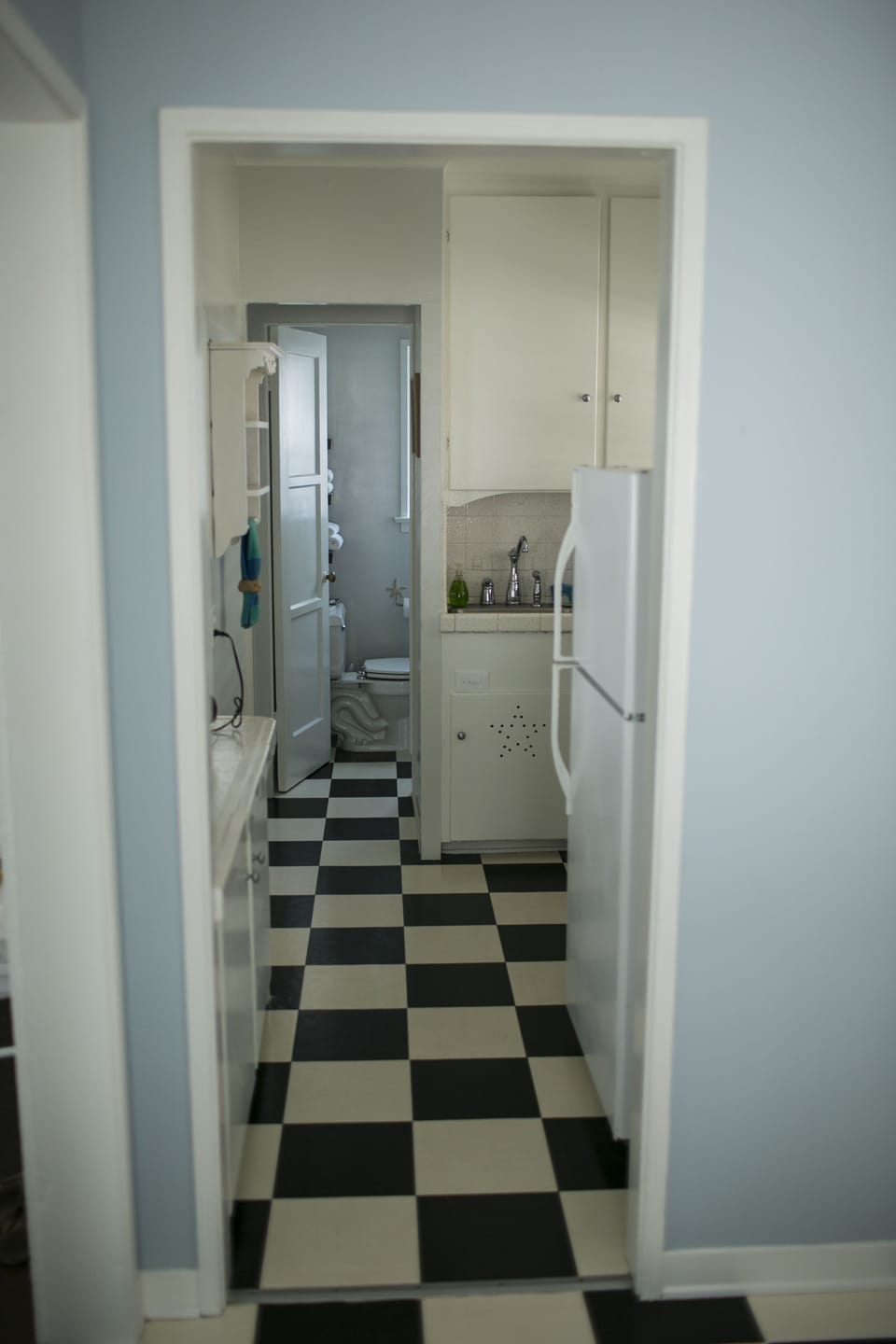 View from the dining room looking through the galley kitchen and bath.