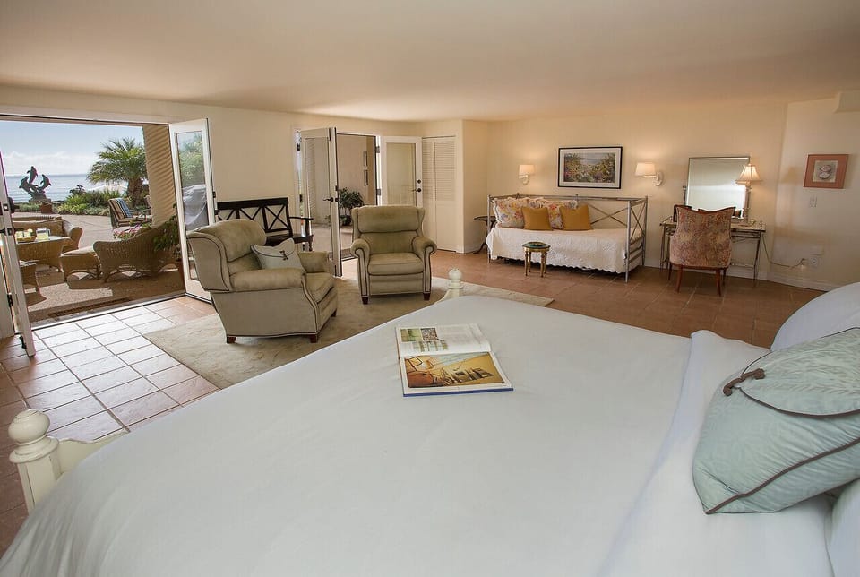 Seaside Room - Bedroom #5~ lower level~ King bed and a Trundle bed (twin/twin) sitting area~ opens to the Lanai