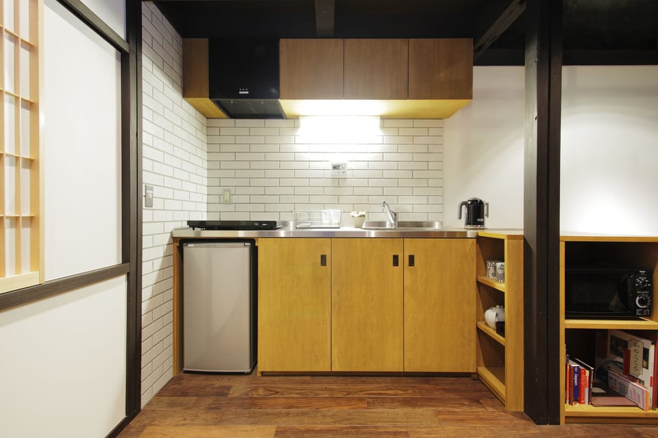 Full kitchen with hob, kettle, microwave oven and toaster.