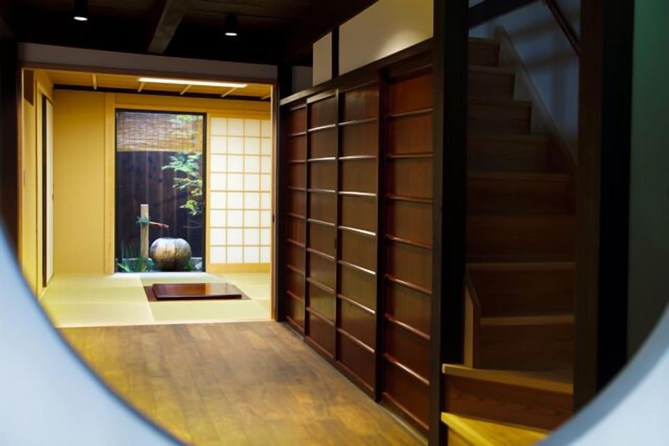Dining area and stairs to the second floor viewed from the entrance hall
(Photo by Kodai Masuda)