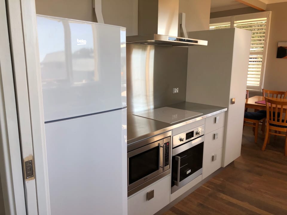 Modern kitchen with induction cooktop.