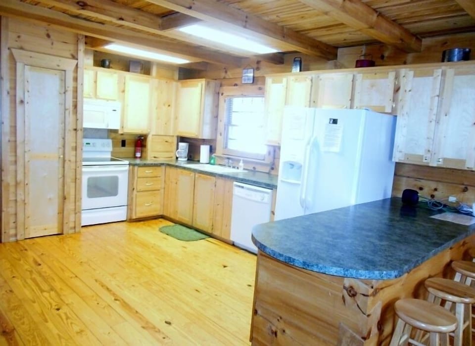 Fully equipped kitchen with all major appliances and eating/cooking ware