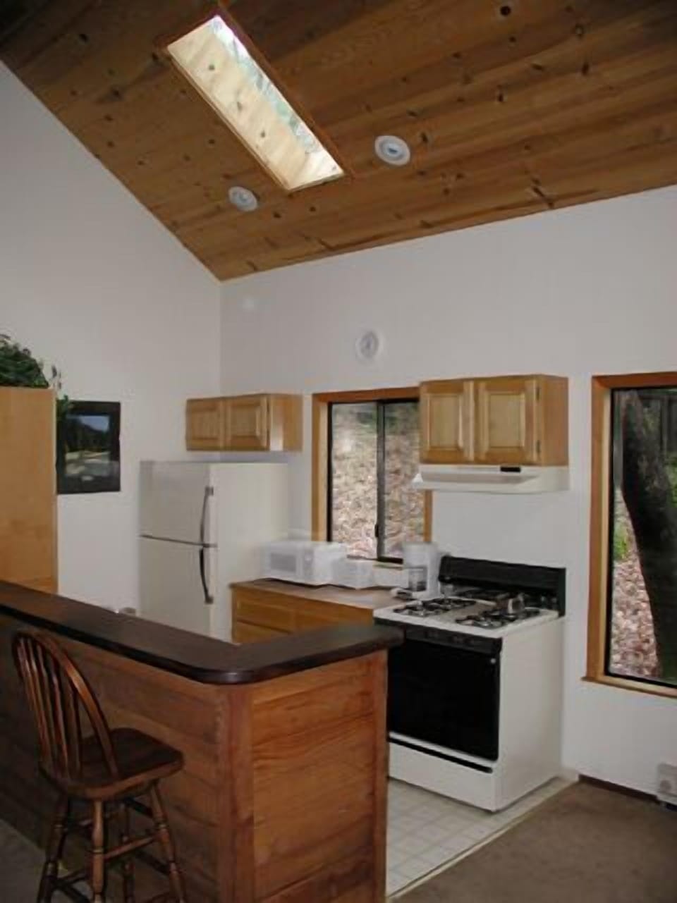 Kitchen is open plan with living area, and dining table (need photo of table! )